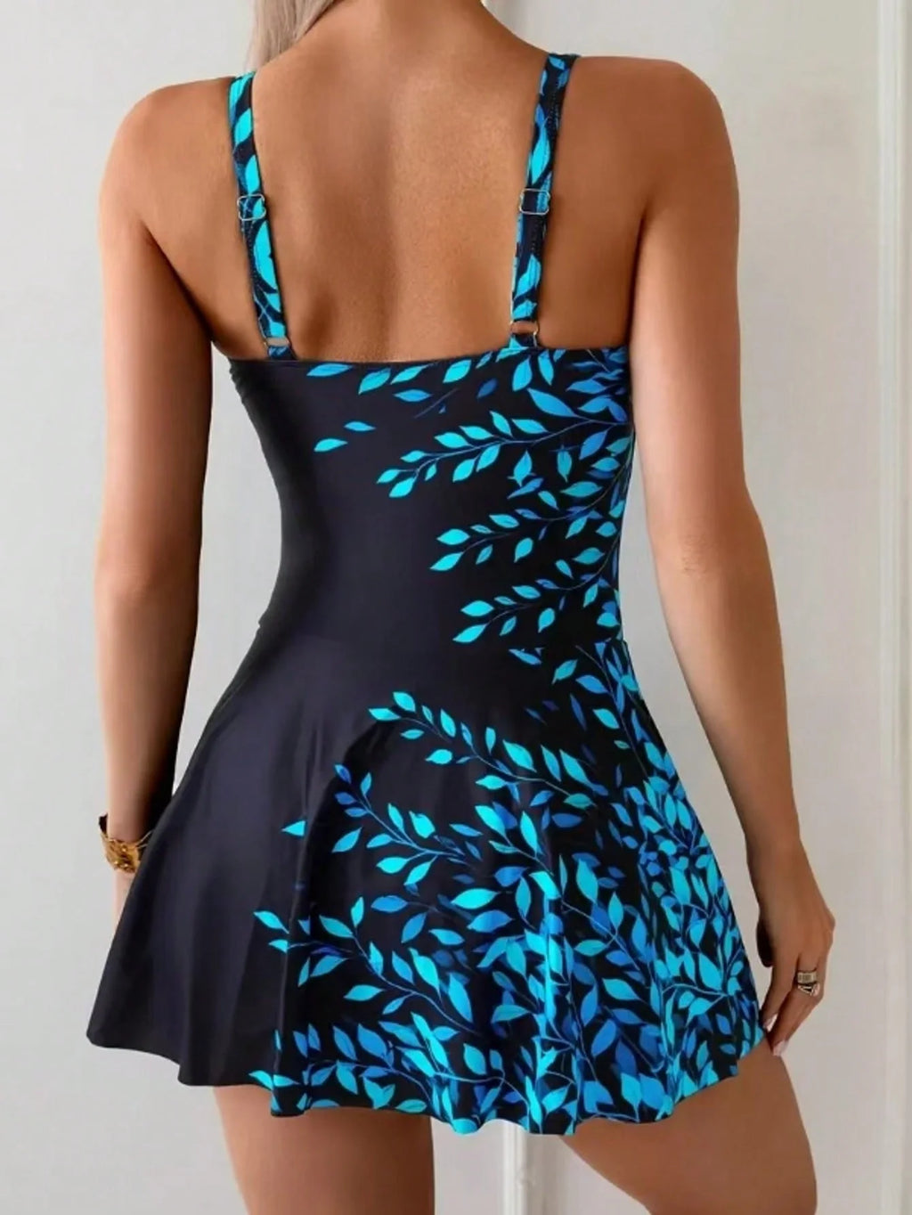 Fashionable And Modest One-Piece Swimsuit for Women with a Leaf Print And Skirt, Designed to Flatter The Figure.